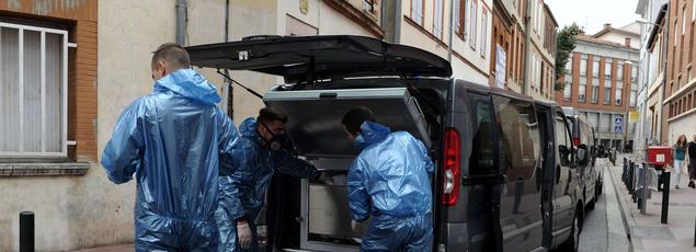 Investigators on the scene, on 4 August.