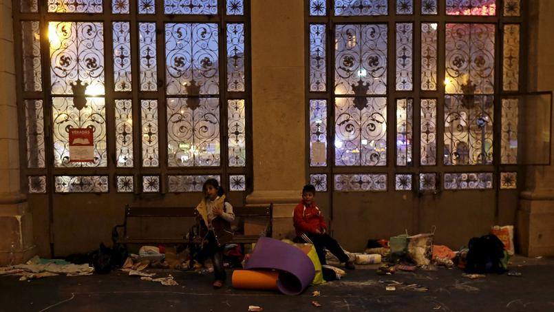 Migrants settled in the Budapest-Kelesti station Saturday in Hungary.