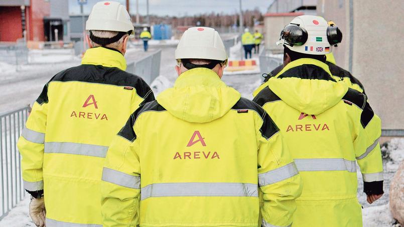 Trois employés sur le chantier de construction du réacteur de troisième génération EPR OL3, à Olkiluoto en Finlande.