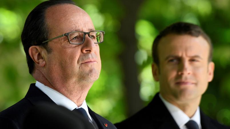 François Hollande et le président élu Emmanuel Macron le 10 mai 2017 dans les jardins du Luxembourg à Paris pour la commémoration de l'abolition de l'esclavage