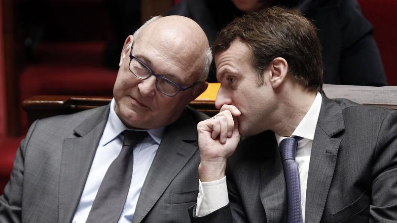 Michel Sapin et Emmanuel Macron à l'Assemblée nationale, le 14 janvier 2015.