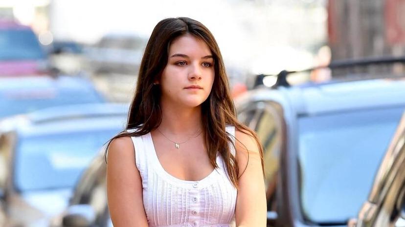 In a little white dress and Converse, Suri Cruise, a teenager like the ...
