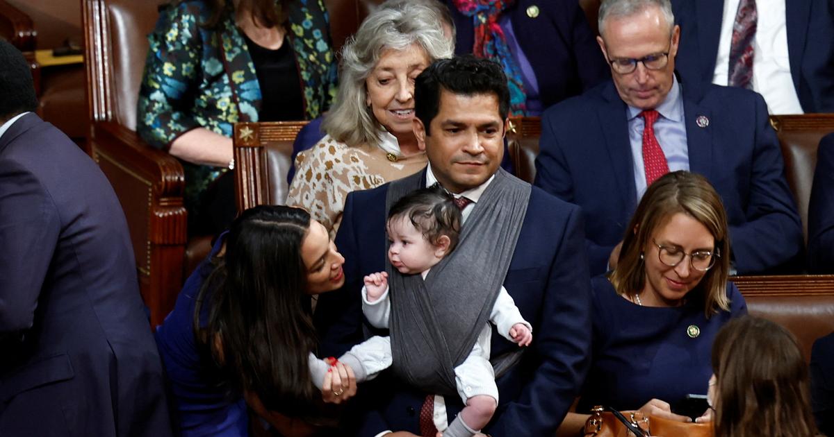 In the video, this American member of parliament comes to the parliament with his child to urge fathers to “do their part”.