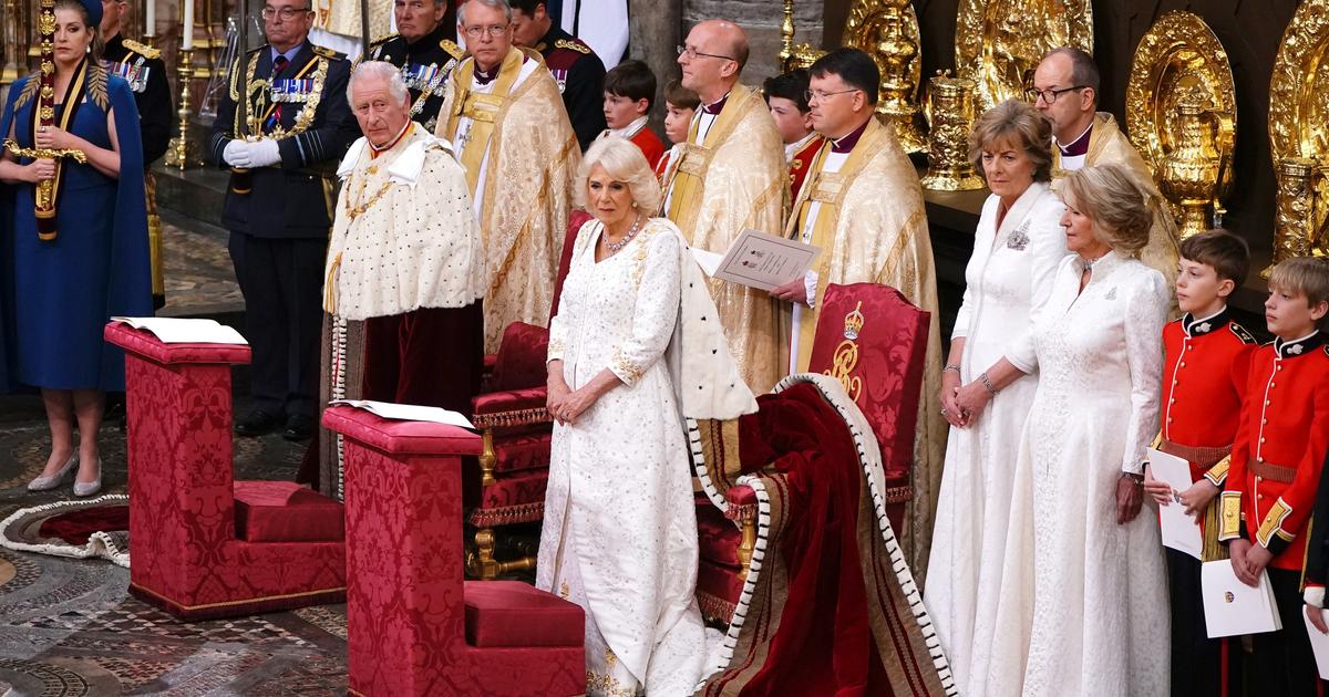 Without the tiara, Camilla arrives in a white state dress, all understated