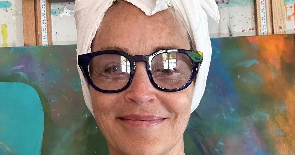 Turban, Crocs and zero makeup.  Sharon Stone’s practical look as she paints her canvases