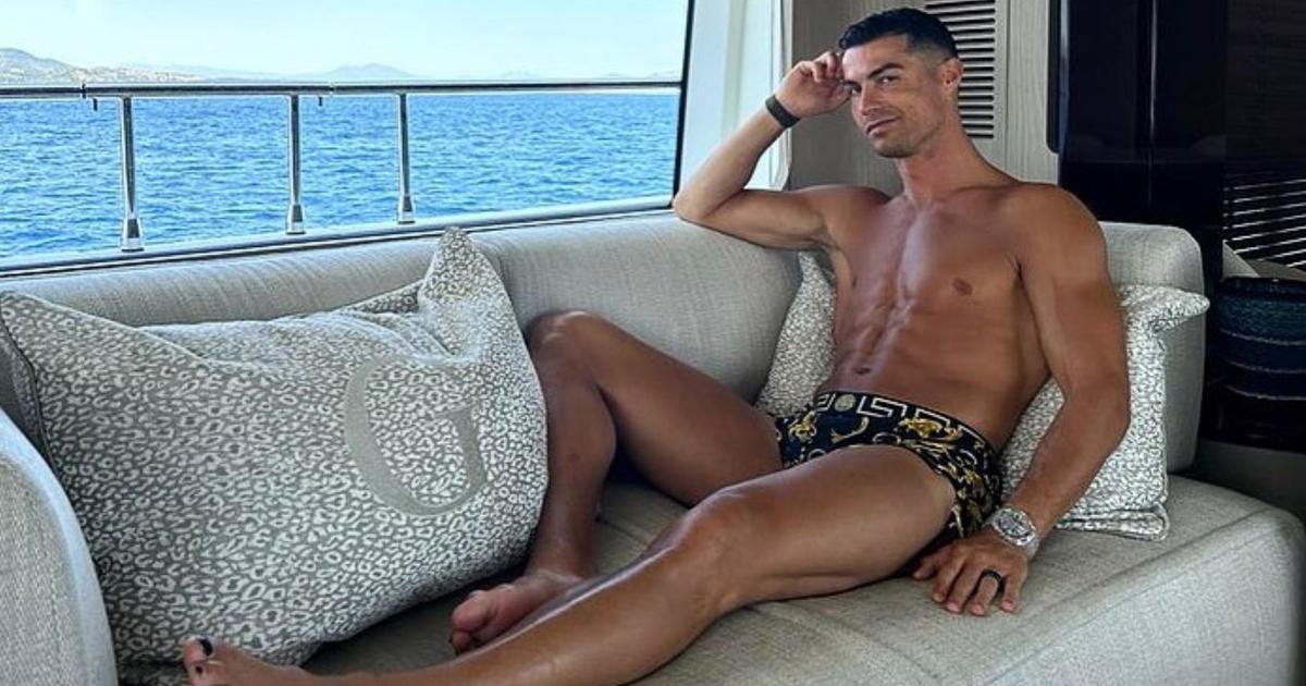 This photo is of Cristiano Ronaldo shirtless, bulging belly, and painted nails on his yacht