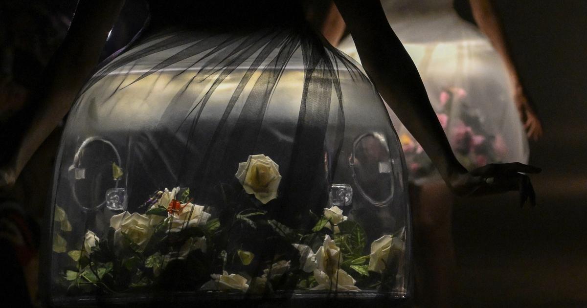 The moment is suspended at Fashion Week.  light-up dresses featuring real butterflies in an underground parade