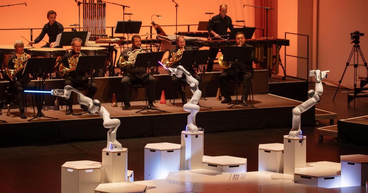 A robot conducts a symphony orchestra in Germany