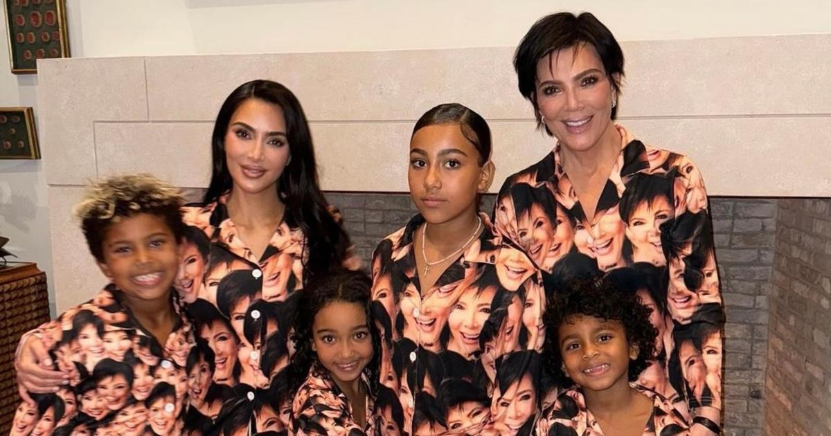 Kim Kardashian poses with four children