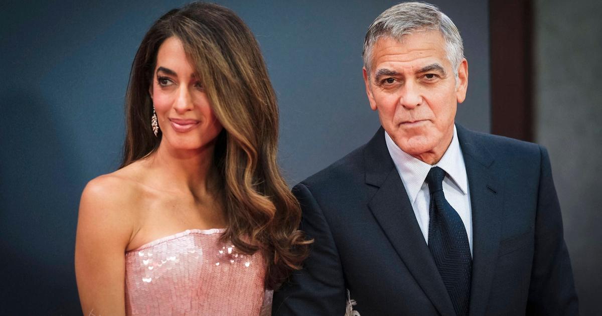 Amal Clooney brille de mille feux au bras de George dans une robe rose scintillante à Londres