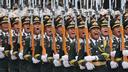 Les gardes d’honneur de l’Armée populaire de libération de la Chine (APL) défilent lors d’une cérémonie d’accueil pour le président russe Vladimir Poutine au Grand Hall du peuple à Pékin, en Chine, le 20 mai 2026.