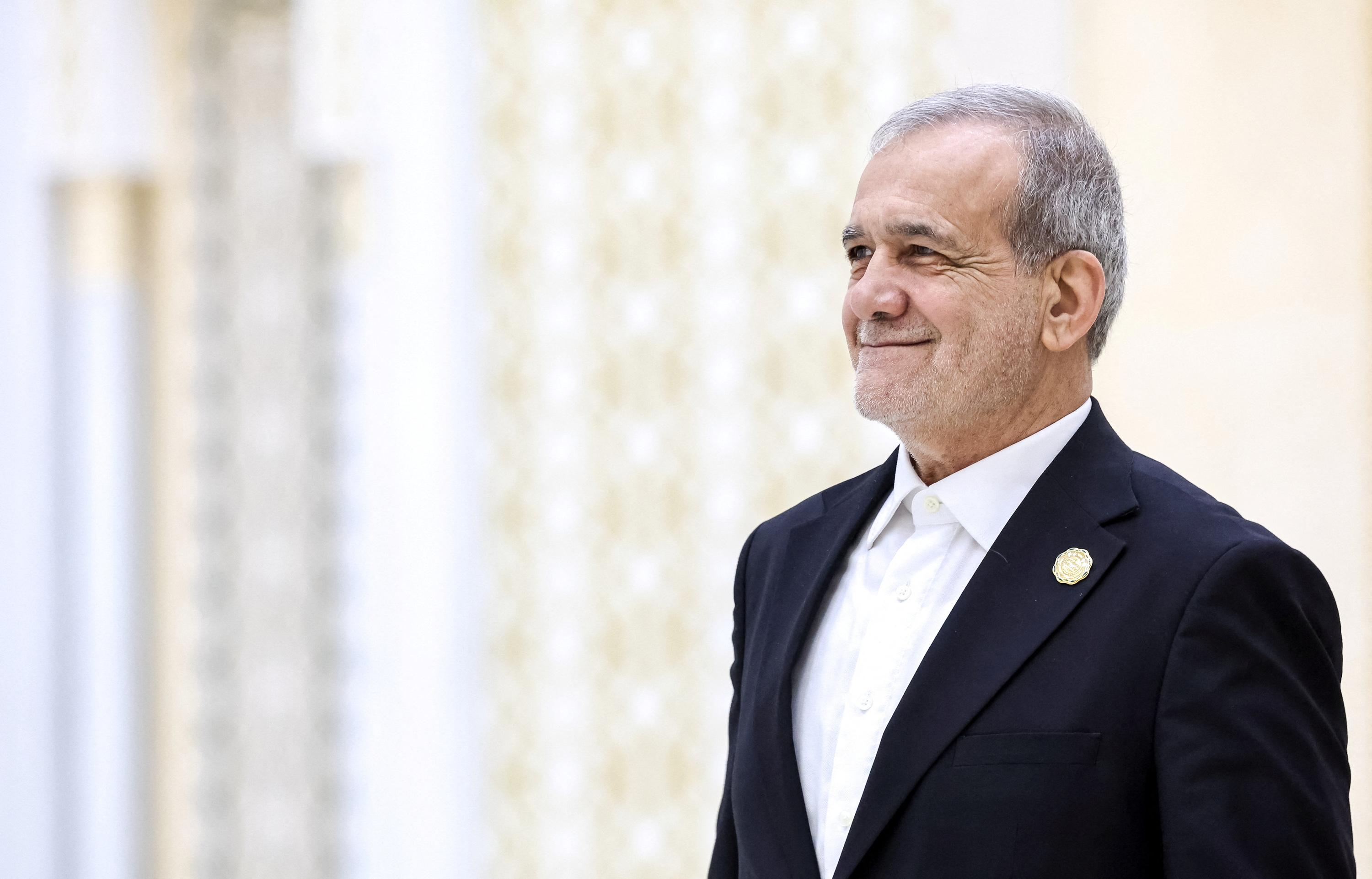 The Iranian president says the United States, Israel and the Europeans are waging a 'total war' against Iran