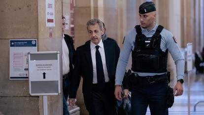 Former France s President Nicolas Sarkozy arrives for his appeal trial over charges he sought Libyan financing for his 2007 election, at the Palais de Justice courthouse in Paris.