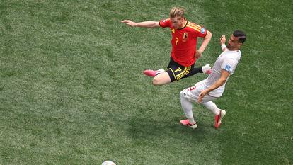 Kevin De Bruyne et Ehsan Hajsafi lors du match Belgique-Iran le dimanche 21 juin 2026