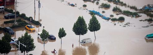 En images : scènes de chaos en Chine après des inondations dévastatrices
