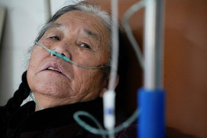 An elderly woman receives oxygen at a hospital in China's Zhejiang province.