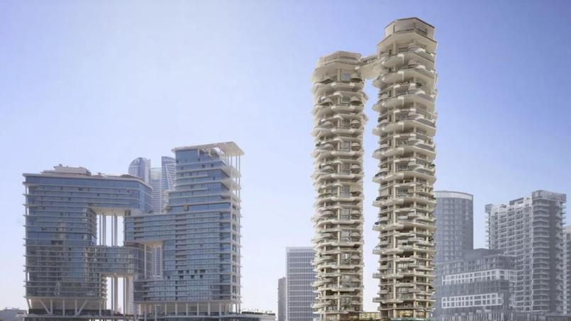 Deux tours jumelles de 180 mètres de haut, reliées à leur sommet par une piscine.