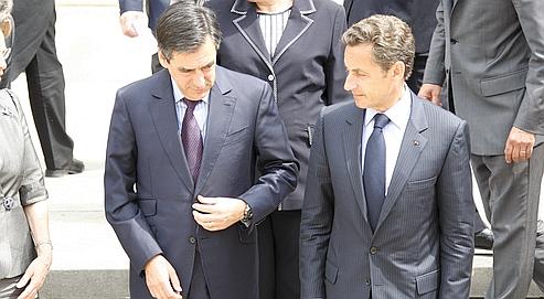 François Fillon et Nicolas Sarkozy, le 24 juin, après le premier Conseil des ministres post-remaniement. (François Bouchon / Le Figaro)